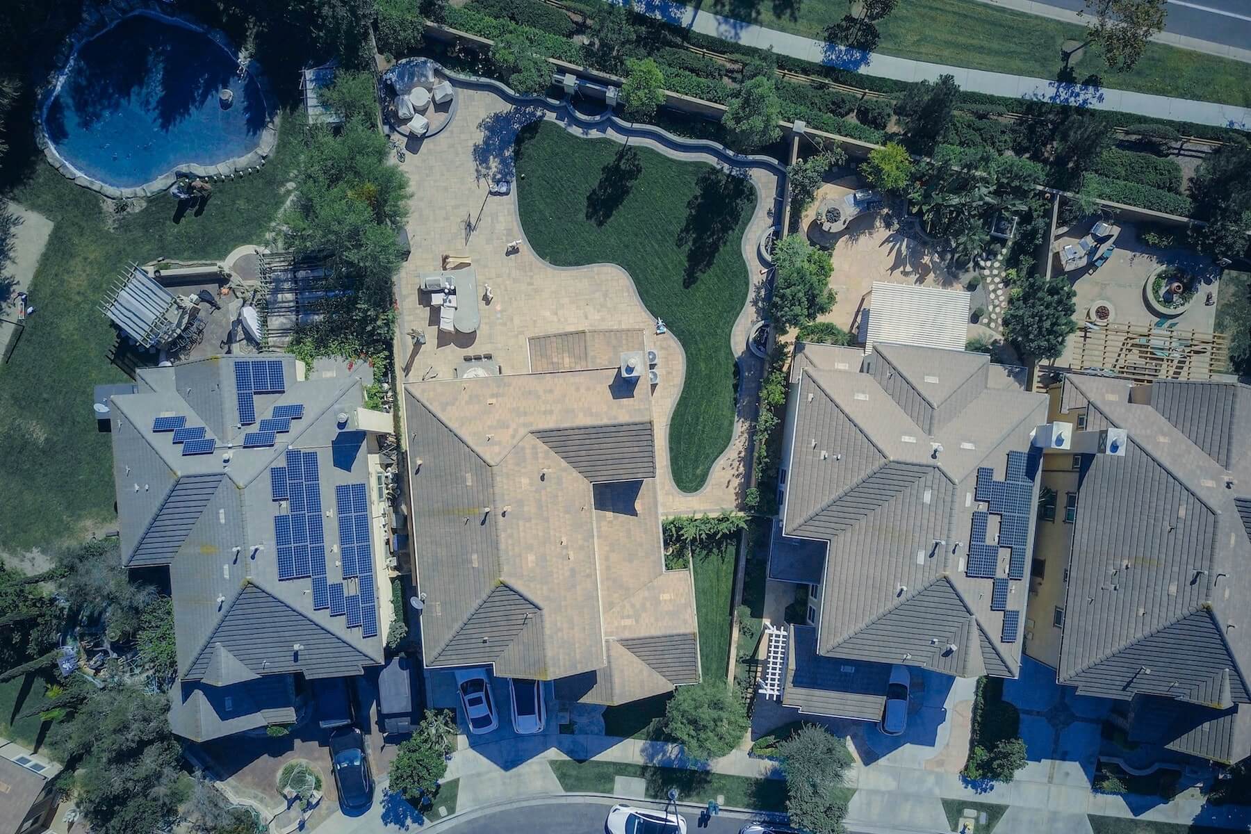 Top down view of eco friendly houses with solar panels installed on roofs