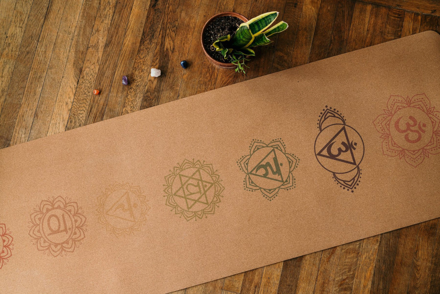 Chakra cork yoga mat on wooden floor