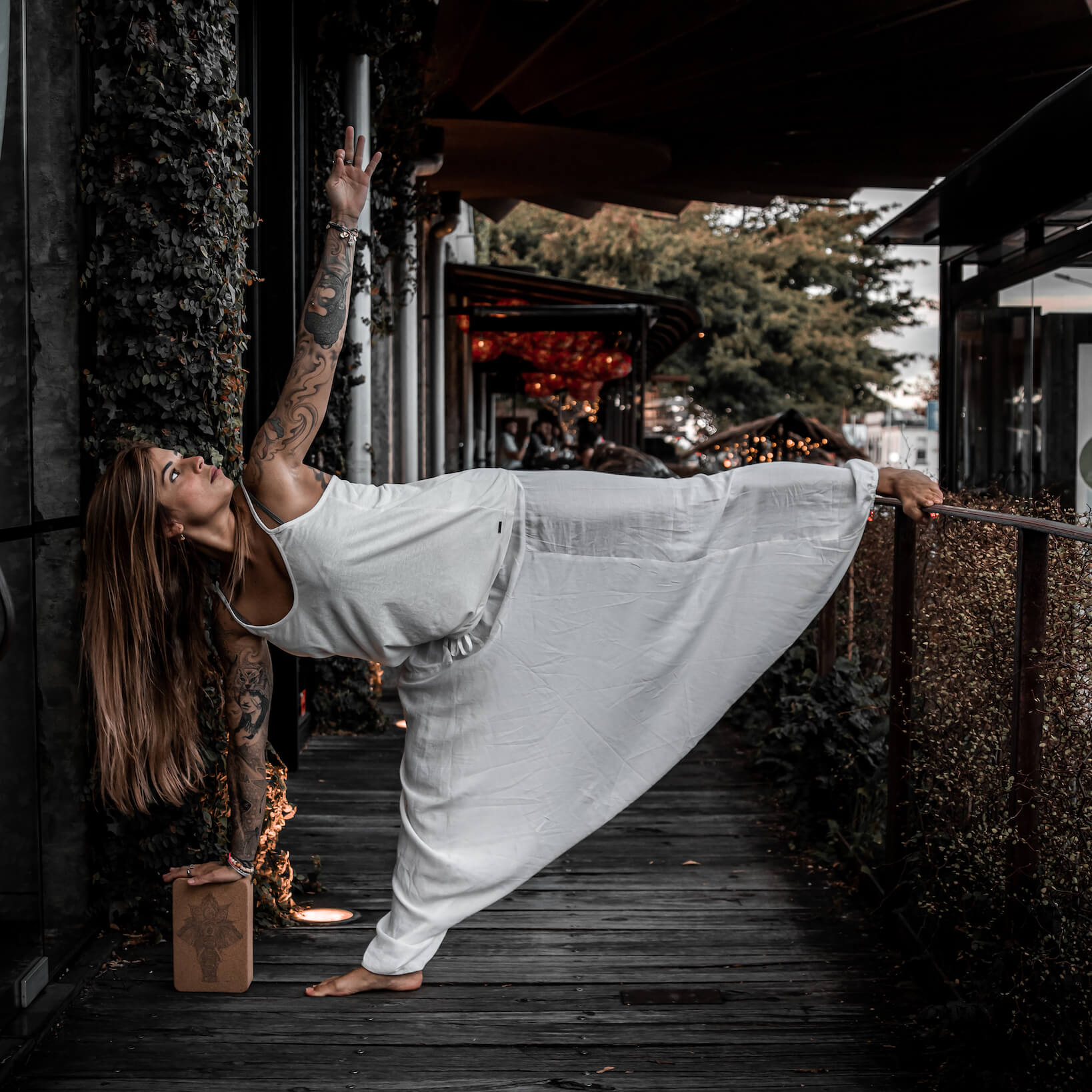 Woman using cork yoga block for support